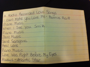 Yellowed index card with list of recorded love songs - Side A