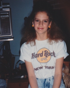 Hard Rock Tee (tucked in and poufed out), high waisted, stonewashed jeans, gold chain, big earring orbs - Brian REALLY wishes he knew me when I had this look.